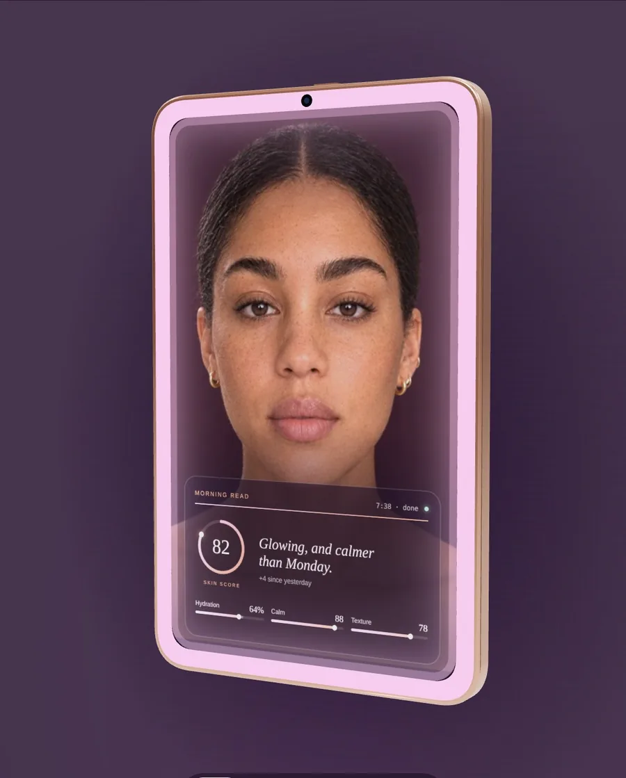 The Aurae smart mirror showing a woman's reflection with her morning skin read