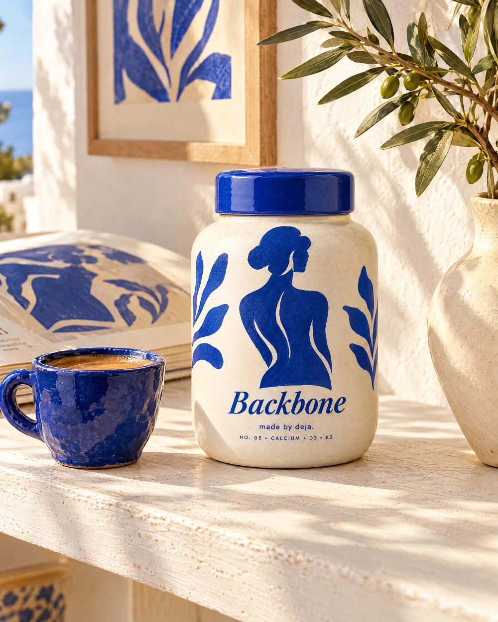 Backbone jar on a sunlit windowsill beside a cobalt mug
